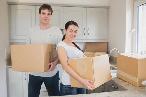 Moving crew wrapping furniture for safe transport